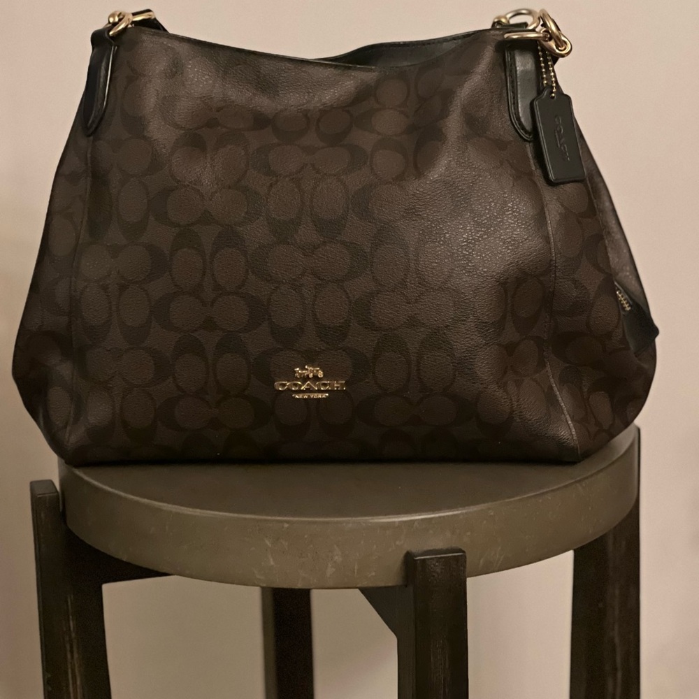 Coach Dark Brown Signature Shoulder Bag
12 1/2 L, 9 3/4 H, 3 3/4 W